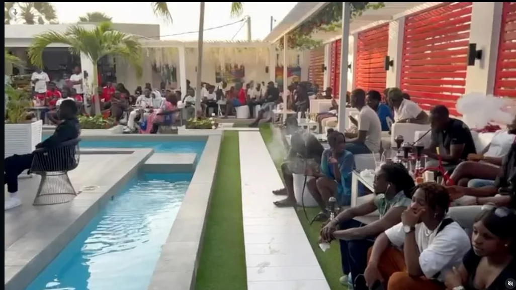 Guests gathered around the open-air poolside lounge at ONYX