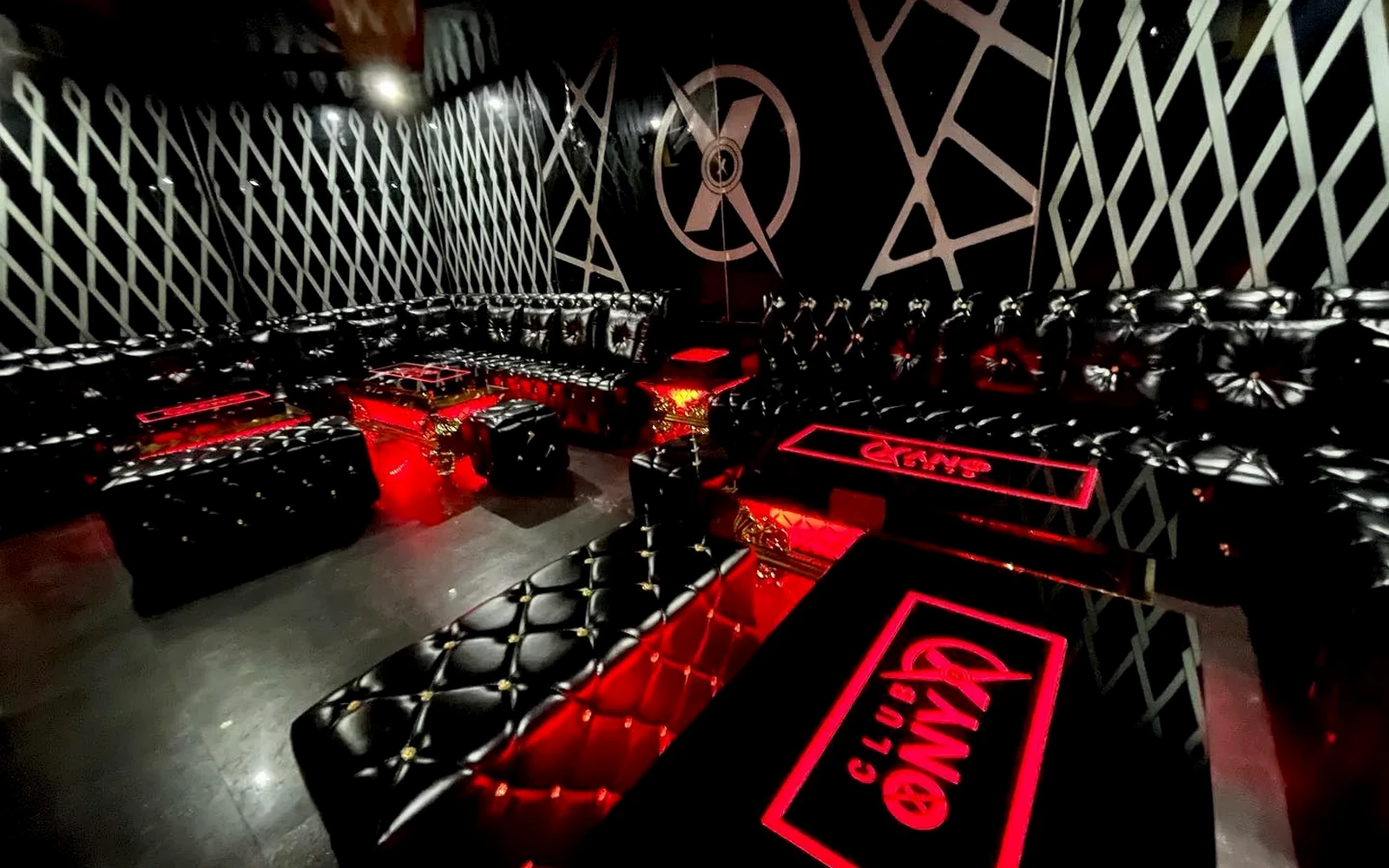 Black and red VIP seating inside Club ONYX