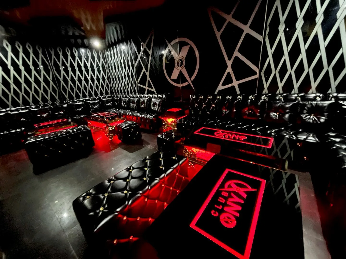 Private black and red VIP seating at ONYX