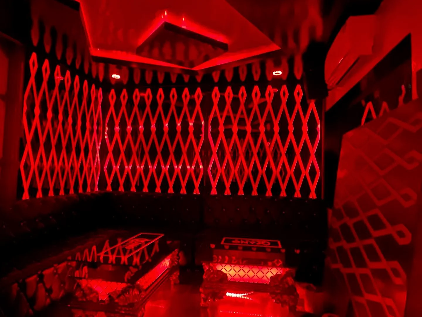 Red-lit private booth inside ONYX